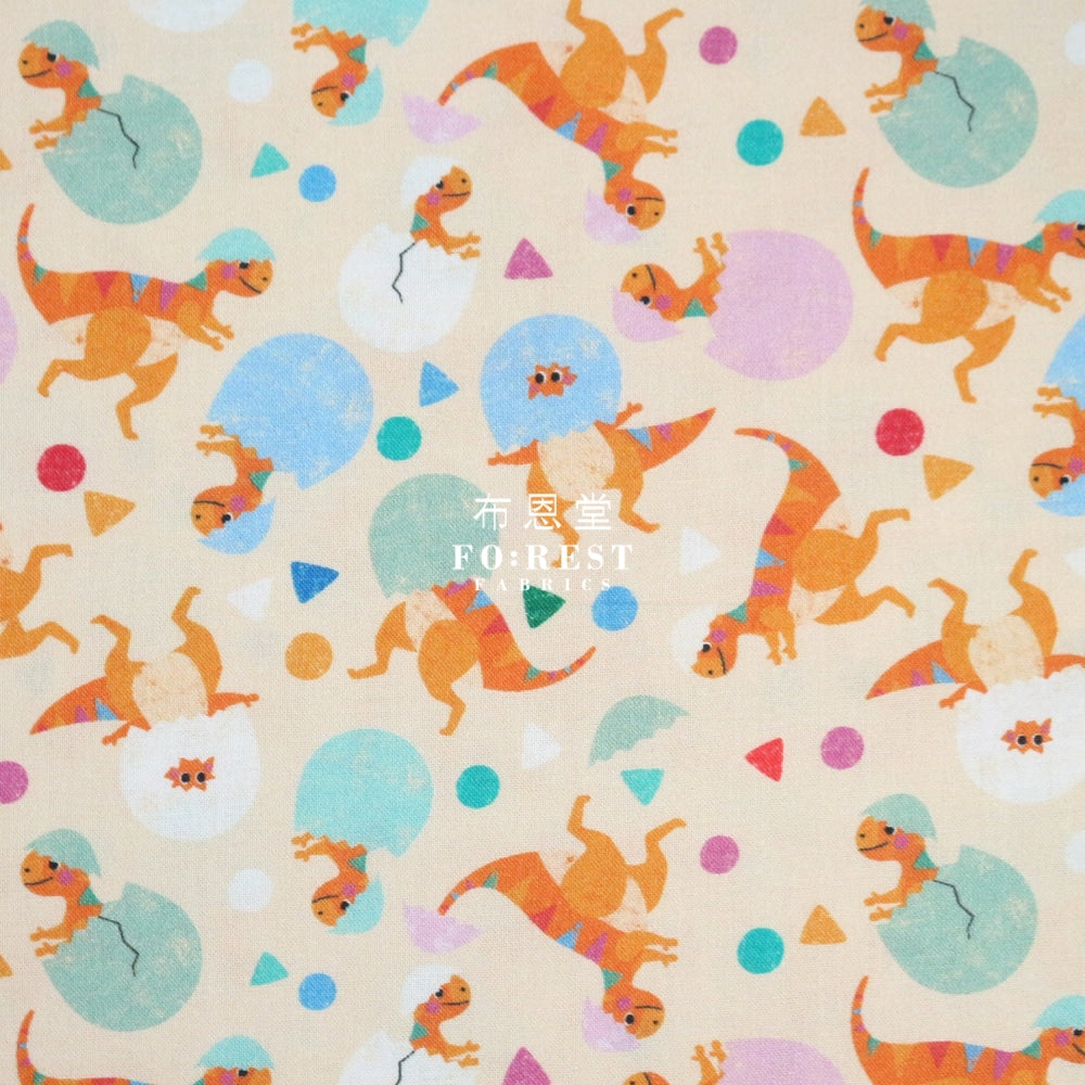 Cotton - Rainbow Hatching Dinosaur Fabric Peach
