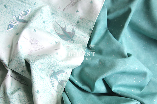 cotton - Swallow in the snow Metallic fabric (green) - forest-fabric